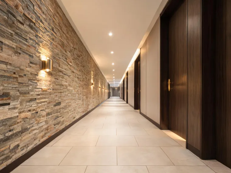Hotel corridor with porcelain tile flooring